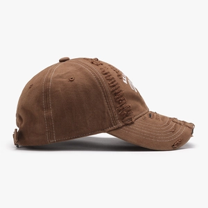 Vintage brown distressed baseball cap with white embroidery and contrast stitching details