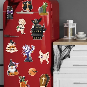 Detailed Halloween magnets featuring gnome, black cat and pumpkin on a red fridge