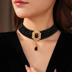 Vintage multi-layer black beaded choker necklace with golden water drop pendant