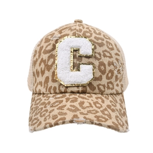Detail of leopard print baseball cap with fuzzy letter C patch and distressed brim edges