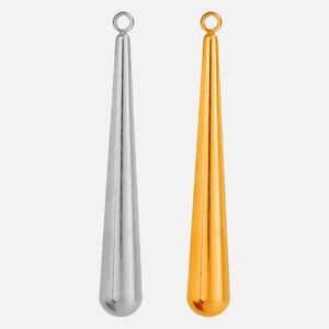 Detailed comparison of gold and silver teardrop pendants with polished metallic finish