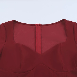 Detail of wine red sweetheart neckline with sheer mesh stitching and hidden zipper
