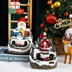 Detailed view of musical rotating Christmas tree resin ornament with miniature train