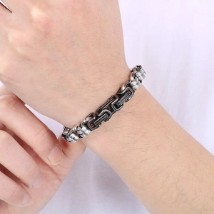 Vintage industrial style men's thick two-tone titanium steel chain bracelet on wrist