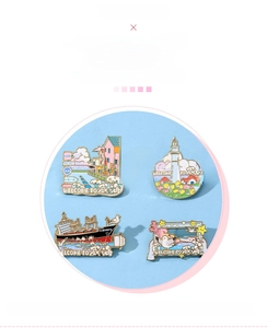 Detail view of four Weihai tourism metal enamel badges featuring coastal landmark designs