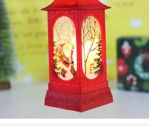 Close-up of red Christmas lantern with Santa Claus scene and warm LED lighting effect
