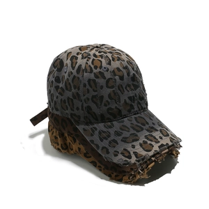 Distressed leopard print baseball caps in grey and yellow canvas with vintage worn edges