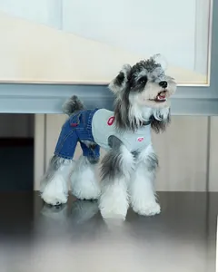 Close-up of dog denim vest featuring blue washed fabric and grey knit ribbing details