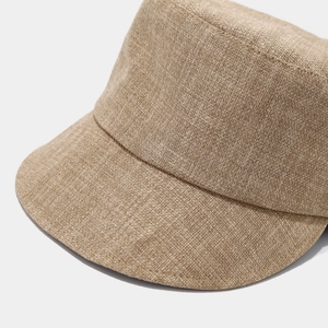 Detail of khaki linen equestrian hat showing fine stitching and breathable woven texture