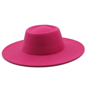 Detail of fuchsia wool felt fedora showing thick texture and flat brim for winter style