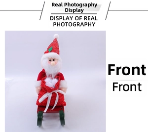 Front view of Santa Claus figurine on red wooden sleigh with gift bag decoration