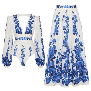 Detail of deep V-neck long sleeve floral top and high waist maxi skirt set