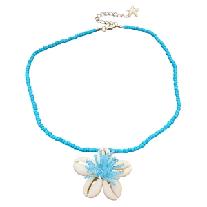 Detail of blue beaded necklace with white shell flower pendant and star charm on silver chain