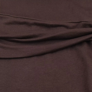 Close-up of the dark brown soft knitted fabric texture on this stylish button dress