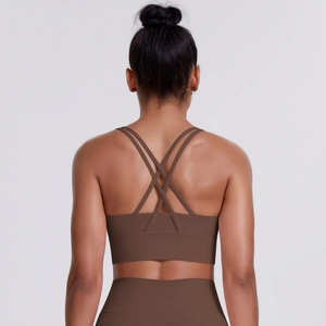 Close-up of brown sports bra showing crisscross back straps and elastic fabric