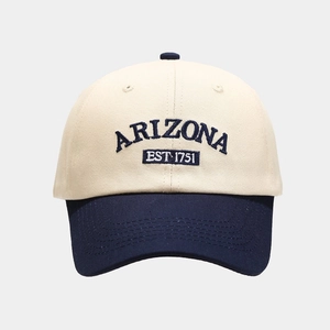 Close-up of Arizona embroidery and color block stitching on a cotton baseball cap