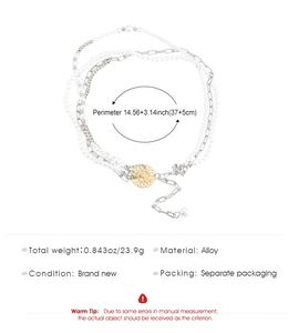 Detail view of multi-layer chain necklace showing a 14.56+3.14 inch length specification