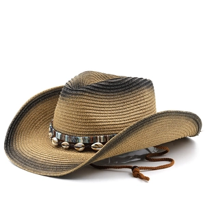 Detail of straw cowboy hat featuring shell beads and ethnic woven band accents