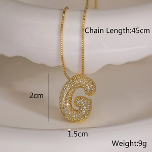 Detail of gold letter G necklace with cubic zirconia showing 45cm chain length and 9g weight