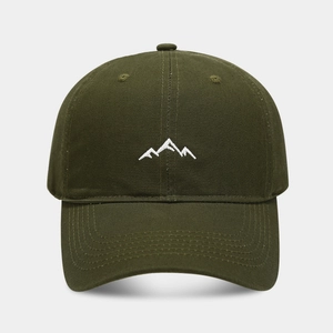 Close-up of olive green baseball cap featuring white mountain range embroidery detail