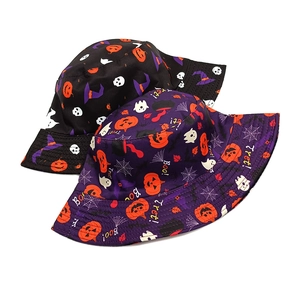 Detail view of Halloween bucket hats with pumpkin, ghost, and skull festive patterns