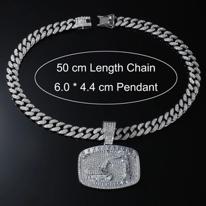 Detailed view of silver iced out excavator pendant with 50 cm Cuban chain for men