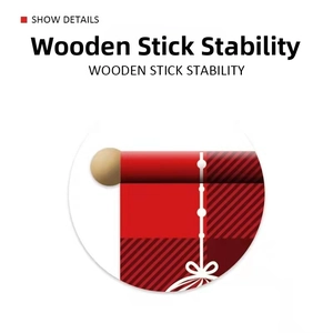 Detail of Christmas banner featuring wooden stick support and red plaid fabric pattern
