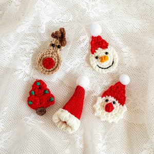 5-piece handmade crochet Christmas ornaments set with Santa, elk, and tree on lace background