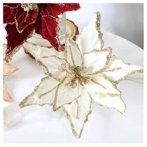 Detailed macro view of velvet Christmas poinsettia flowers with glitter edges and petals