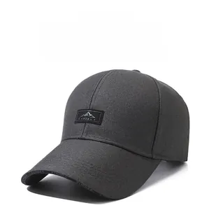 Detail of gray cotton baseball cap featuring embroidered square patch with mountain and China