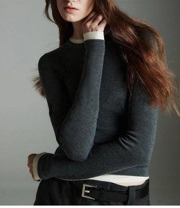 Detail of wool blend slim-fit knit top with contrasting collar and cuffs in dark grey