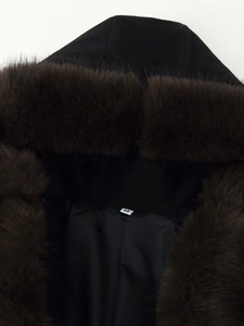 Close-up of fluffy dark brown faux fur collar on black hooded wool coat with M size tag