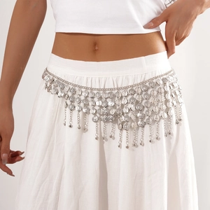 Silver multi-layer bohemian waist chain featuring coin fringe pendants on white dress