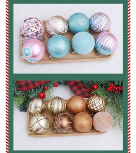 Detail of colorful painted Christmas balls with glitter and hollow designs on a tray