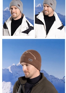 Close-up of winter knit beanie showing vertical ribbing and premium mountain leather patch