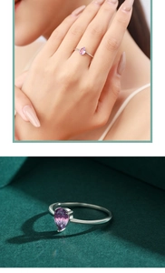 Close-up of a s925 silver ring featuring a purple teardrop-shaped faux tourmaline stone