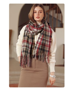 Close-up of classic plaid scarf texture and fringe detail on warm winter accessory