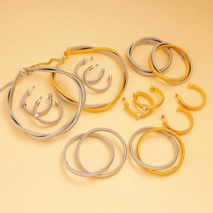 Detailed close-up of two-tone snake chain jewelry set with necklace and bracelet