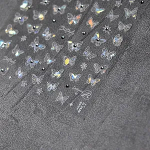 Iridescent butterfly nail art stickers with 3D crystal accents and shimmering star patterns