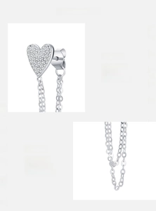 Macro detail of S925 sterling silver heart earrings with pavé cubic zirconia and chain