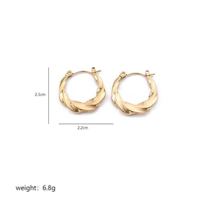 Detailed size view of twisted gold hoop earrings with weight and dimension labels