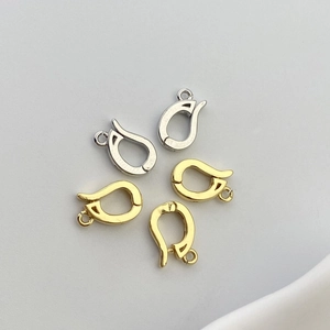 Macro view of 18K gold and silver plated U-shaped jewelry ear hooks and connectors