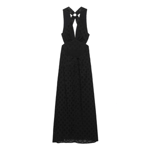 Detail view of black eyelet embroidery and hollow out metal ring design on halter dress