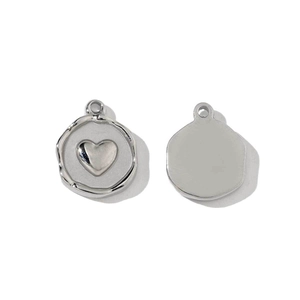 Detailed front and back view of silver heart pendant with embossed center and irregular edge
