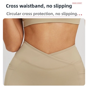 Detail of high-waist yoga shorts with V-cross waistband and convenient side pockets