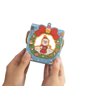 Blue Christmas gift box with Santa Claus window and red ribbon handle for candies