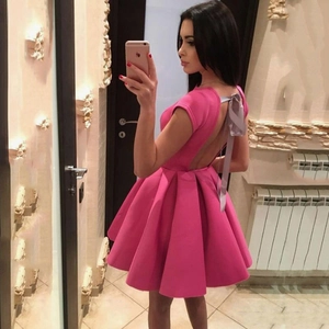 Elegant hot pink backless evening dress with a grey satin bow and pleated puffy skirt