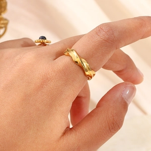 Minimalist 18K gold plated stainless steel geometric wavy ring worn on index finger