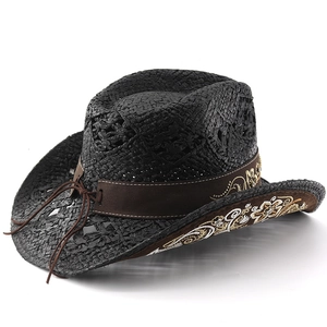 Detail of black woven cowboy hat featuring floral embroidery on the brown suede brim