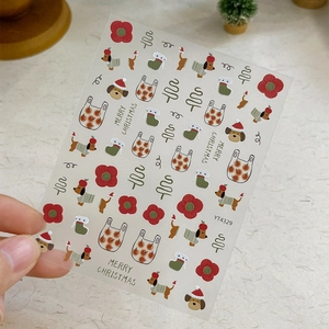 Christmas nail art stickers with embossed dog, tree and flower patterns on nails